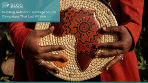 Close-up of hands holding a woven African basket with a leather map of Africa design, symbolising heritage and cultural storytelling.